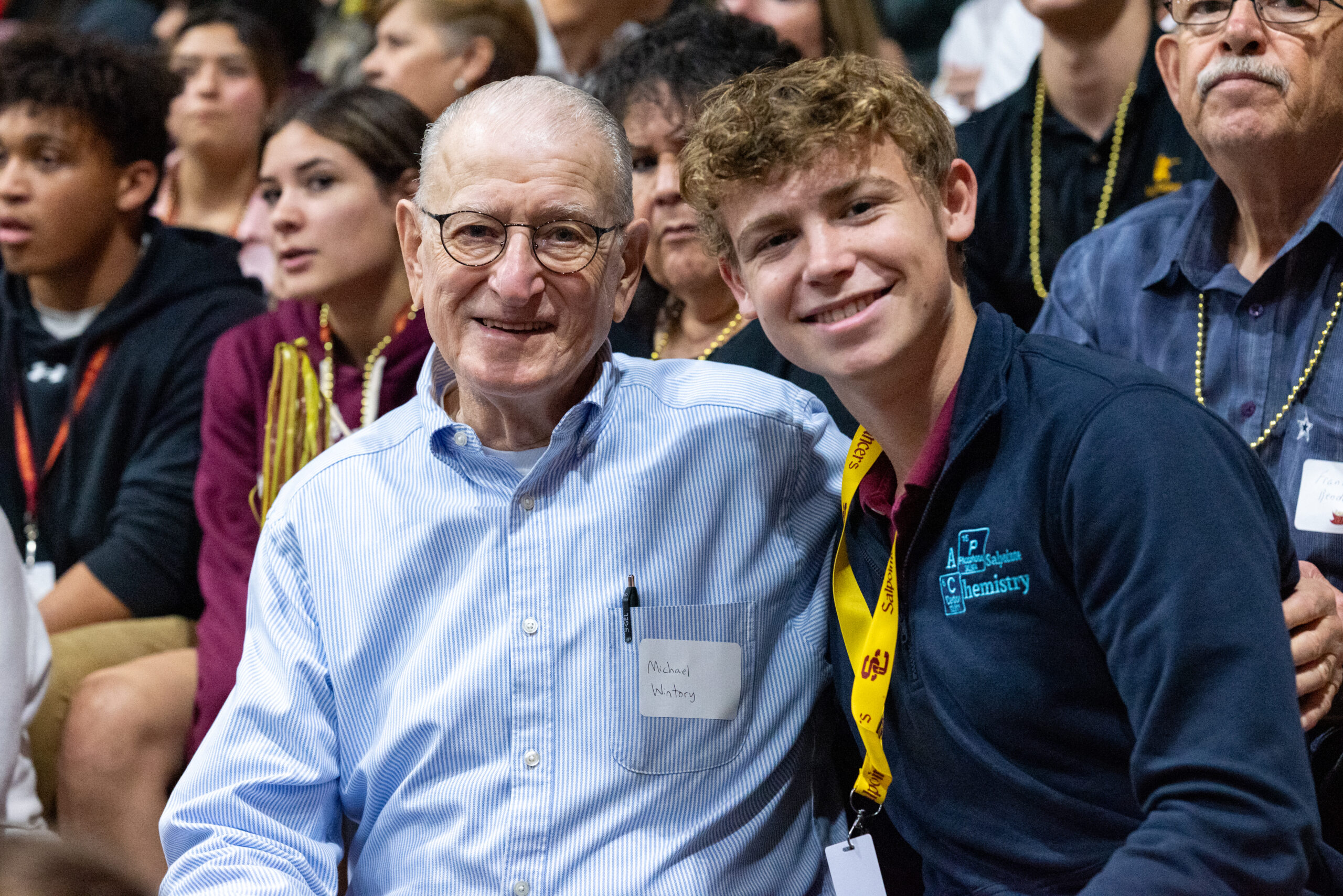 Student posing with older man
