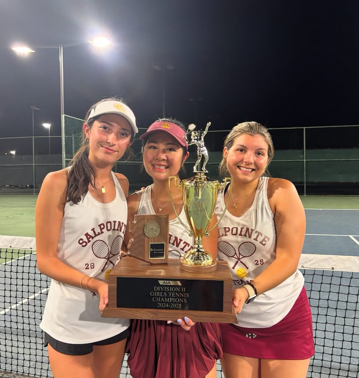 Tennis State Champions Celebrating with Trophy