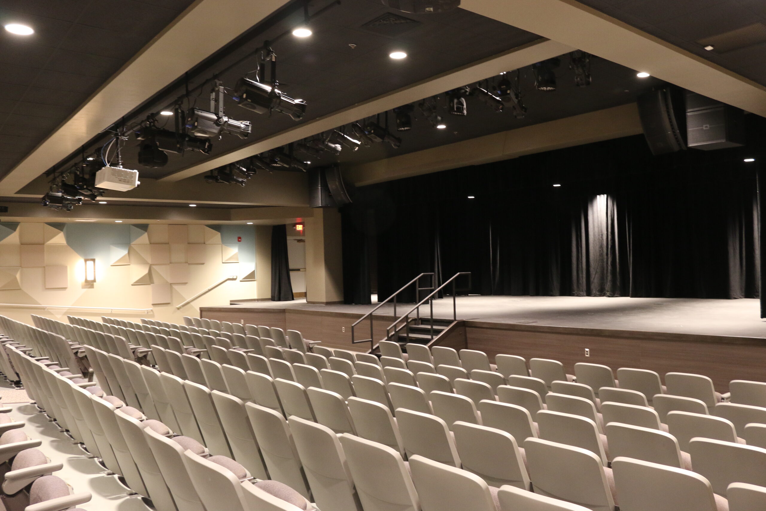 Image of Corcoran Theater empty of students or teachers. Over 250 seats